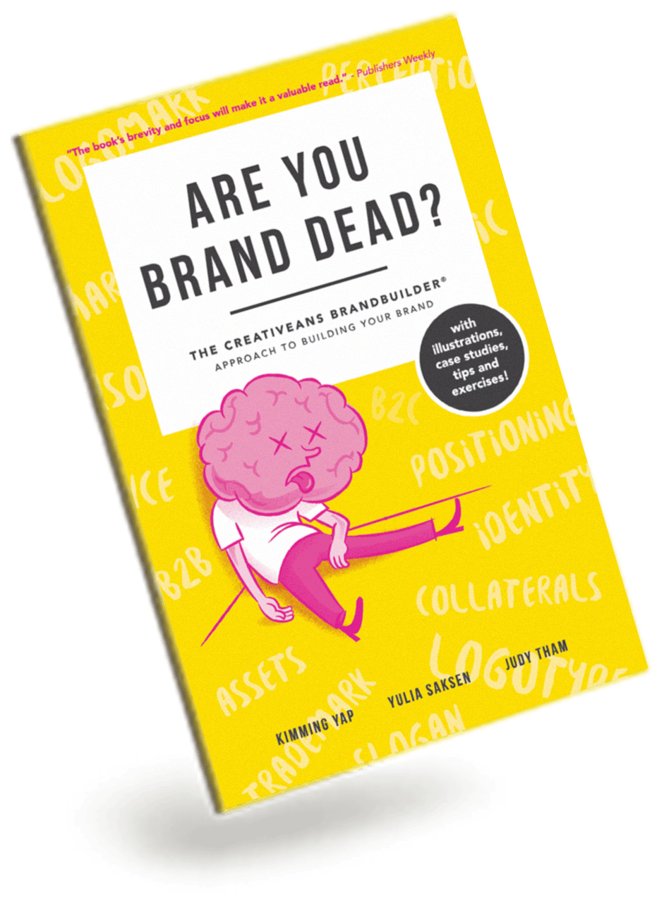 Book cover titled 'Are You Brand Dead?' with a yellow background and a pink brain cartoon illustration, suggesting branding concepts.