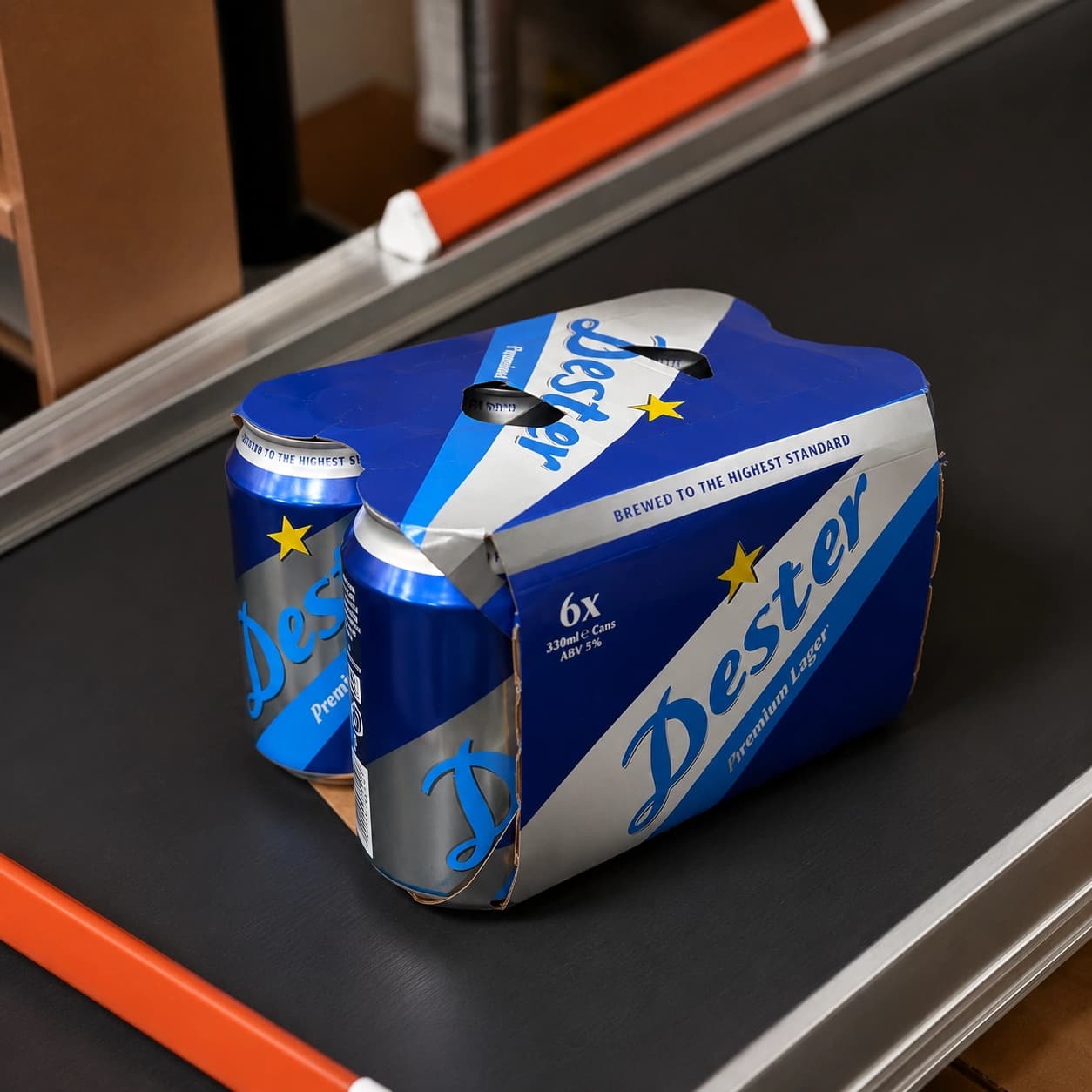 Six-pack of blue Desper Premium Lager beer cans on a black conveyor belt in a warehouse setting.